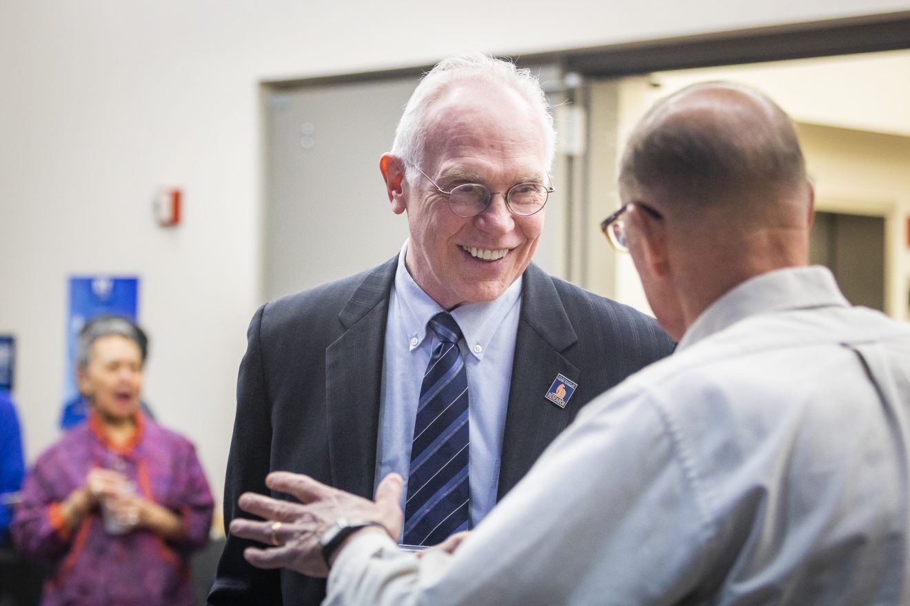 UAF Vice Chancellor Larry Hinzman speaks with chief scientist John Walsh during an event celebrating the 20th anniversary of the International Arctic Research Center on March 4, 2019, at the Akasofu Building.