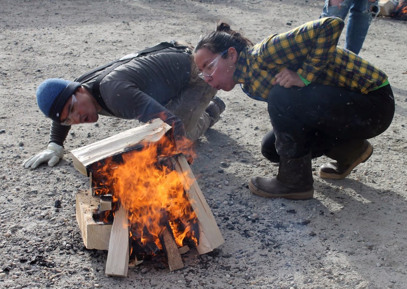 Jon Hutchinson and Ida Petersen work to start a campfire during the 2018 Forest Sports Festival at Ballaine Lake. Photo by Debbie Carter