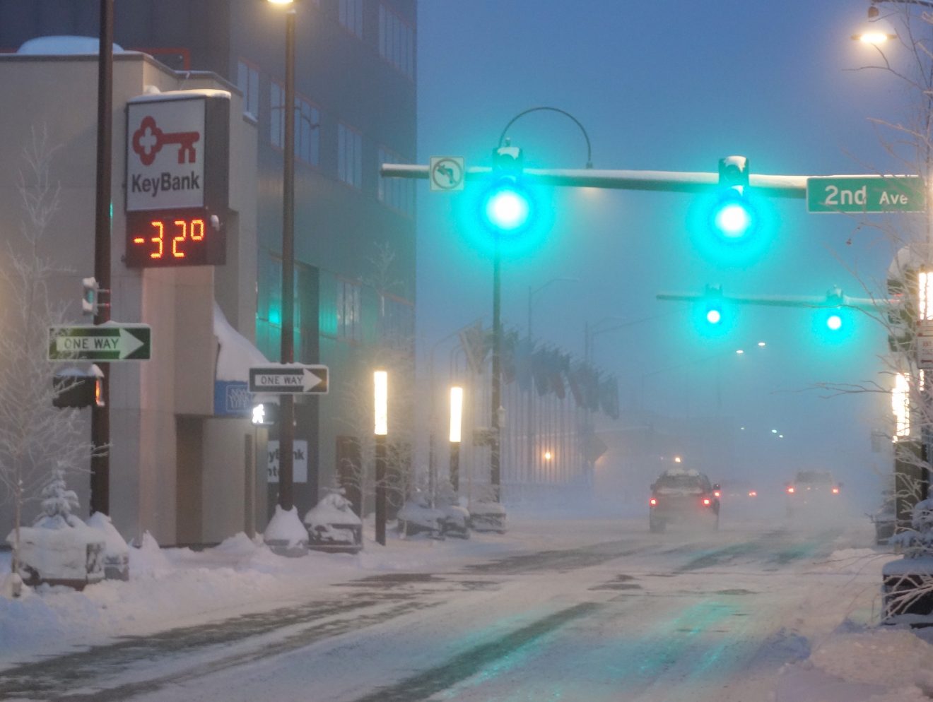 Ice fog obscures a street in Fairbanks where the temperature sign reads -32.