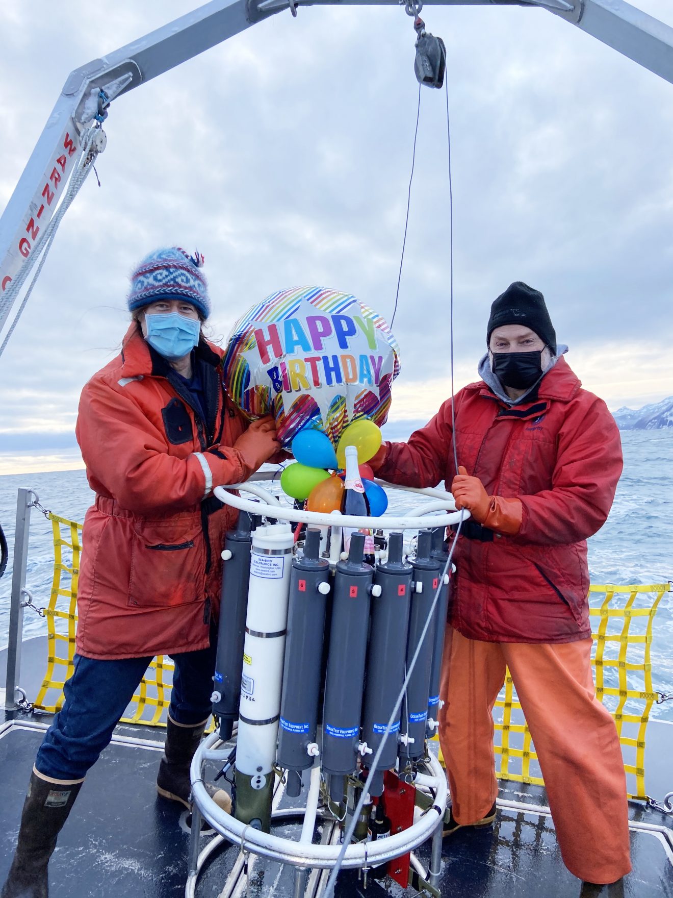 Photo by Gillian Braver. CFOS faculty Seth Danielson and Russ Hopcroft celebrate the 50th birthday of the GAK-1 oceanographic monitoring site in Resurrection Bay. Scientists have used SMC as a base for more than 100 occupations of GAK-1 since December 10, 1970.