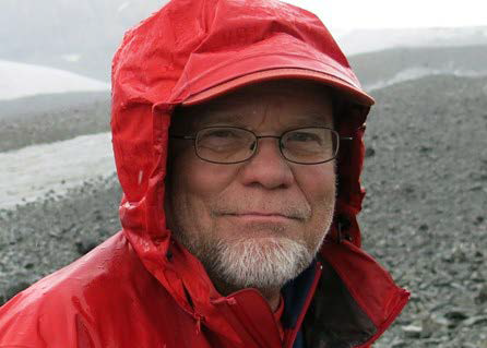 Head shot of John Eichelberger. He is wearing a rain coat.