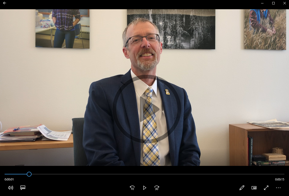 Screen shot of video of chancellor in his office