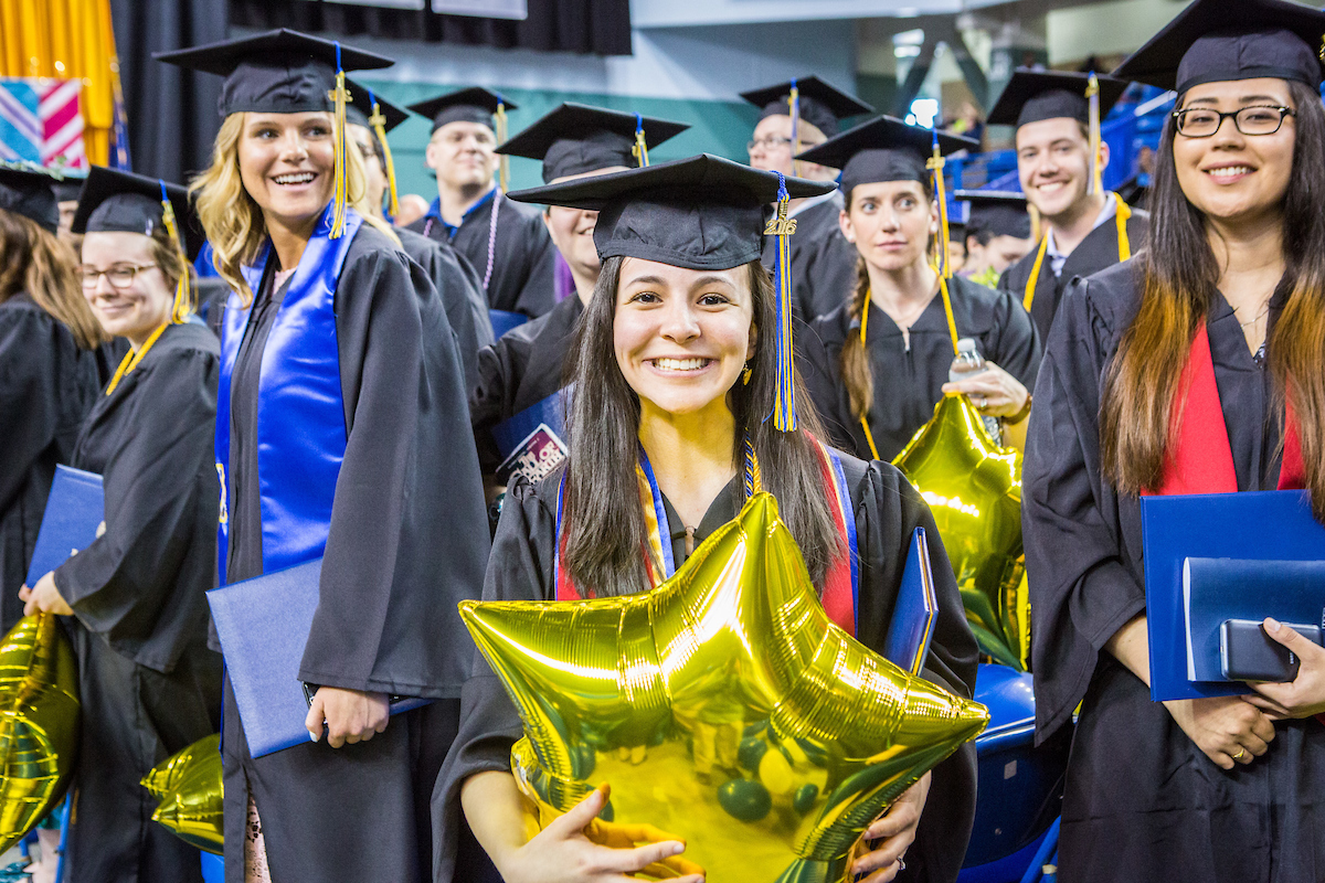 Honors thesis scholar and magna cum laude graduate Meryem Kugzruk pauses for a phtograph during the commencement ceremony May 8, 2016, at the Carlson Center. Kugzruk received an undergraduate degree in English. UAF Photo by JR Ancheta