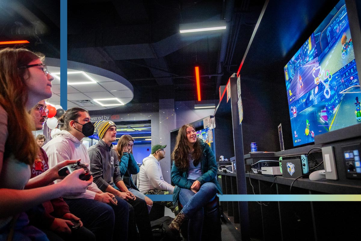 A group of UAF stuents play console games in the Esports Center