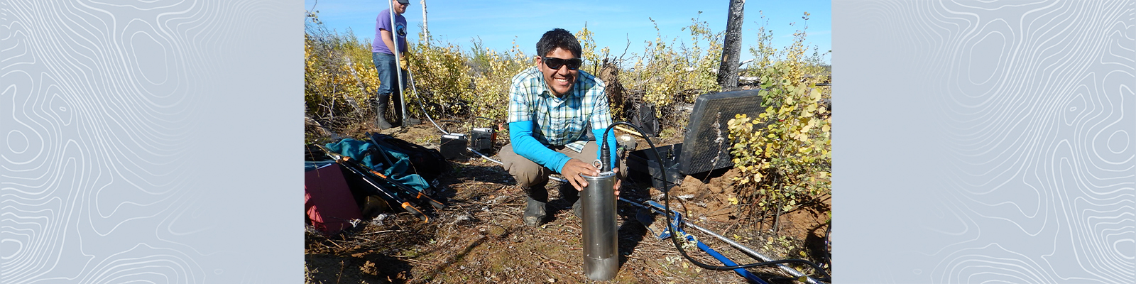 Researcher in the field with equipment