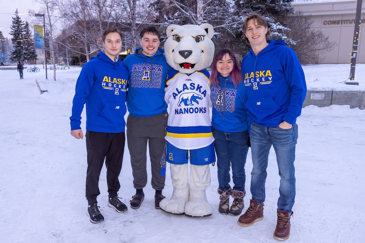 UAF students pose with the Nanook mascot