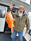 Roscoe Archer IV holding a snapper