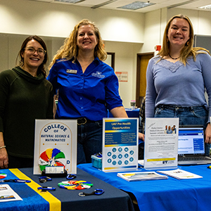 UAF's CNSM Gracie Raymond (left), Amy Wald (center) and Emily Camp (right) during Major Mania in the Wood Center on Tuesday, October 17, 2023. UAF Photo by Marina Santos.