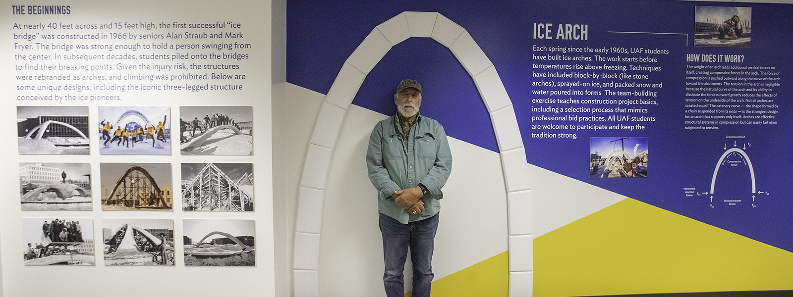 Alan Straub ’66 stands in front of the ice arch display in the College of Engineering and Mines during the 2022 Nanook Rendezvous alumni reunion. He was one of the two students who constructed the first successful ice bridge on the campus. 