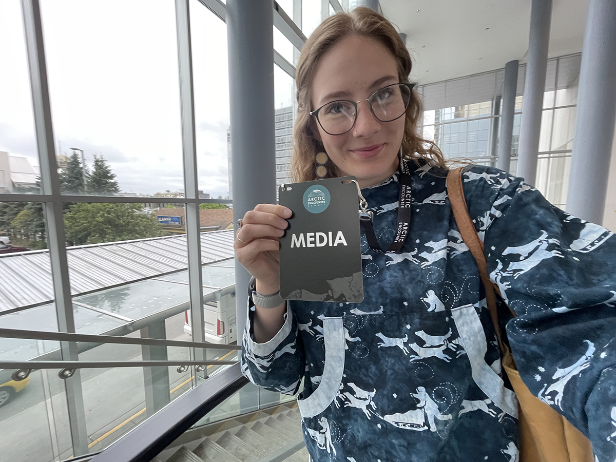 Journalism student Lizzy Hahn displays a media pass at Arctic Encounters from her time in her professional internship class through UAF with ADN. Photo credit Lizzy Hahn
