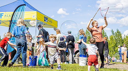 LARS Birthday Bash attendees play with bubbles during the event held on Saturday, June 1, 2024.