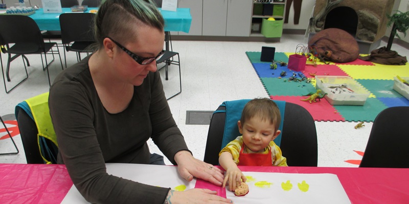 Adult and child paint in the museum's Creativity Lab