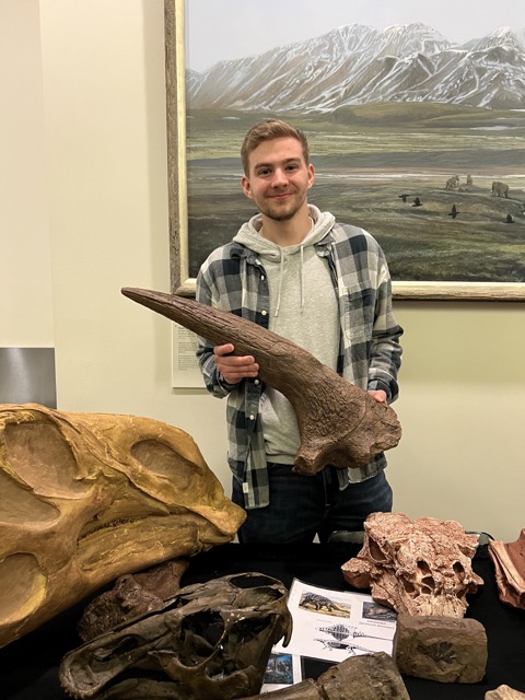 Caden holding a Triceratops brow horn