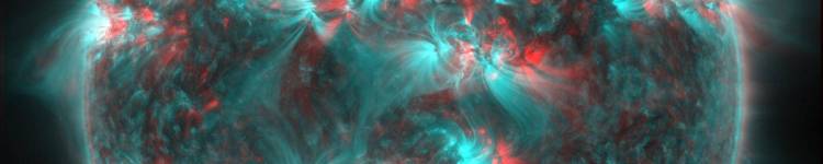 Magnetic field lines of the sun shown in teal and red.