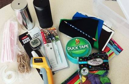 Hands-on items for Ice Drifter workshop, including duct tape, thermometers, and silver cans.