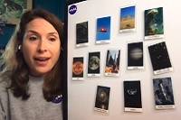 An educator shows a board with pictures of various astronomical objects on it.
