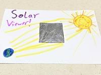 Example Solar Viewer: Piece of cardstock decorated with markers, with square of aluminum foil in the middle,