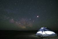 A tent under a starry sky.