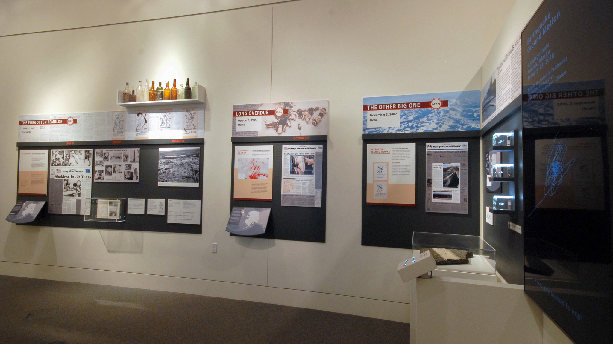 This part of the south wall showcased events from 1967, 1995, and 2002, as well as the digital newspapers collection and scale models of ground motion in Alaska.