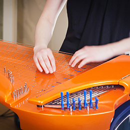 Olga's hands on an electric kantele | Photo taken from the artist's website: http://www.olgashishkina.me/