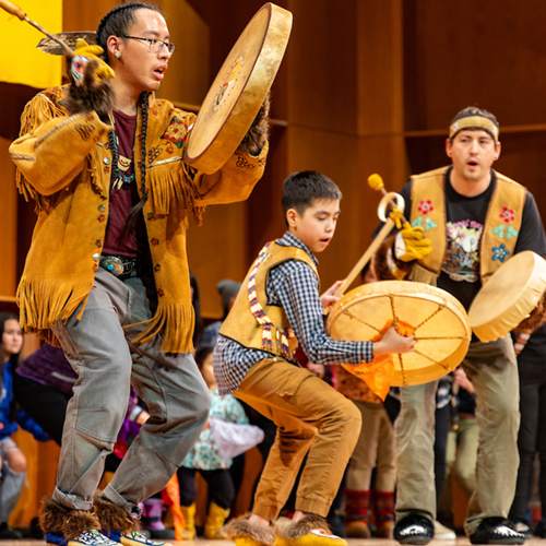 Naatanii Mayo (left) and the Troth Yeddha Dance Group performs on the third and final day of the 50th Anniversary Festival of Native Arts, 2/24/24. (UAF photo by Leif Van Cise)