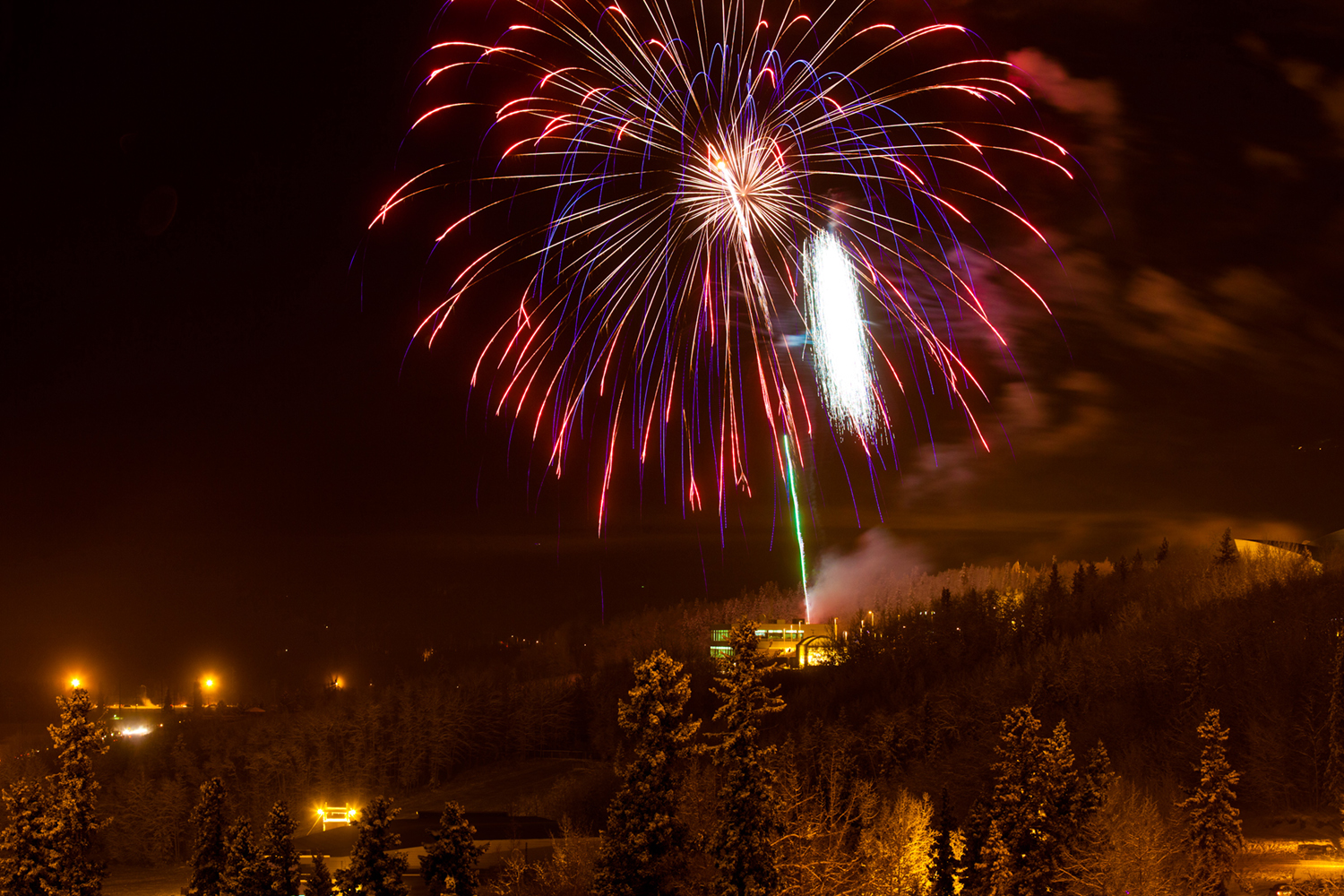 Fireworks light up the sky above UAF's West Ridge during the annual New Year's Eve Sparktacular. The event is organized by Mike Thomas, owner of University Chevron, and is sponsored by a group of Fairbanks community groups. UAF Photo by Todd Paris