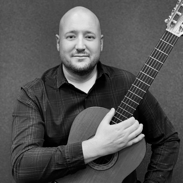 Nathan Arnold poses with his guitar. UAF Photo