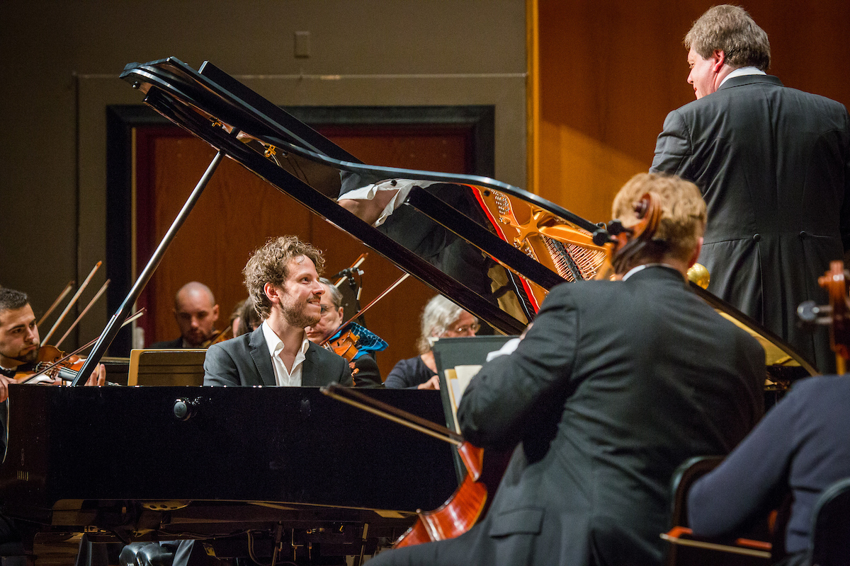 Peter Friis Johansson, finalist and Winner of the Alaska International Piano-e_Competition, performs with the Fairbanks Symphony Orchestra during the final takes a bow after his finals performance round at the Davis Concert Hall. UAF Photo by JR Ancheta