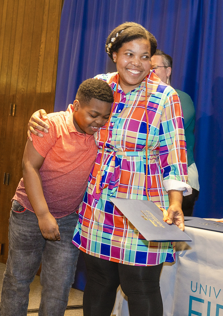 Gina Henry Louis gets a congratulatory hug from her son Jonah Louis after during the 2024 CTC Traiblazer Recognition Ceremony.