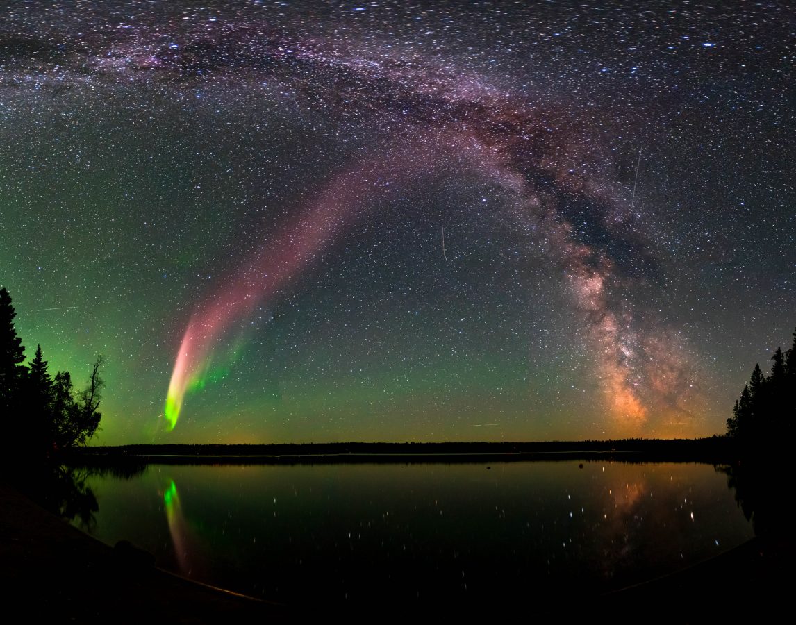 Image courtesy of Krista Trinder and NASA The Strong Thermal Emission Velocity Enhancement, visible as a pink band rising from the lower left to upper right of this photograph, appears with the Milky Way over Childs Lake, Manitoba, Canada. Scientists have recently confirmed STEVE is a unique phenomenon and not a kind of aurora, as previously thought. The picture is a composite of 11 images stitched together.