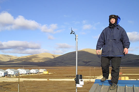 Hal stands on weather station in Brevig Mission