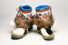 A picture of some beaded Athabascan boots against a white background.
