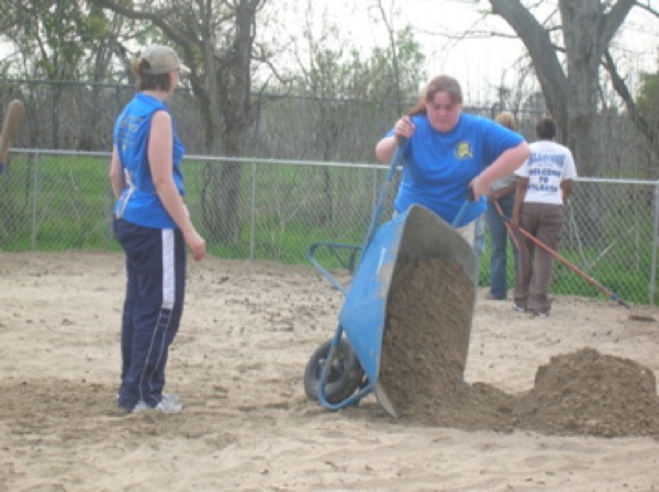 Renee Pasker and Erica Milstead do some dirt work. Photo by Clarissa Ribbens