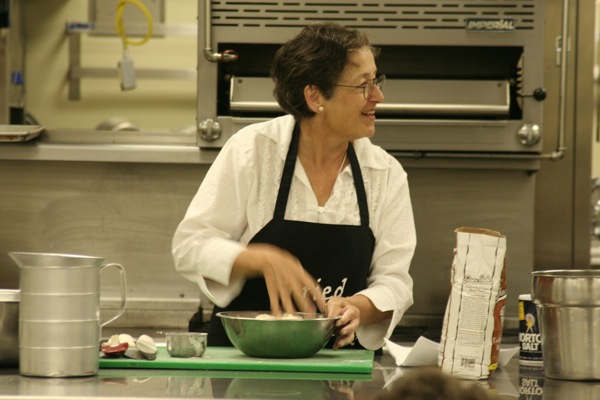 Cookbook author Ann Chandonnet demonstrates a recipe from her book, Gold Rush Grub From Turpentine Stew to Hoochinoo, in the teaching kitchens at the Hutchison Institute of Technology.