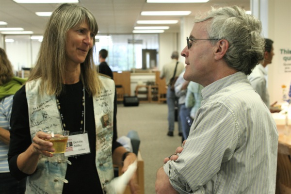 Dermot Cole chats with Debbie Miller at a reception in the Rasmuson Library. Each of these authors participated in multiple sessions at the book festival.
