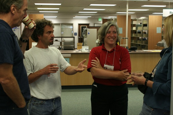 From left to right John Taliaferro, Seth Kantner, Natalie Forshaw and Sherry Simpson engage in a discussion during a reception at the Rasmuson Library.