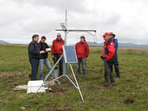 Photo by Sergei Marchenko. UAF professor of geophysics Vladimir Romanovsky, left, shares information with a group at a permafrost observatory at Imnaviat Creek on Alaska’s North Slope.