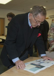 UAF photo by Todd Paris. Sen.Ted Stevens looks at documents during a tour of the Rasmuson Library archives shortly after he deposited a huge collection of photos and papers from his career in the U.S. Senate to the library.