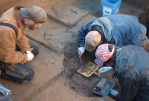Photo courtesy of Ben Potter. Joshua Reuther, Ben Potter and Joel Irish excavate the burial pit at the Upward Sun River site in Alaska.