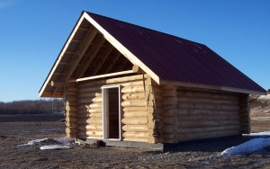 Photo courtesy of UAF School of Natural Resources and Agricultural Sciences. This cabin was built at last year's log cabin building workshop.