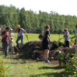 Photo courtesy of Wild Rise Farm..  Local teens help make compost at Wild Rose Farm.