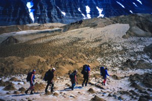 Photo by Ned Rozell. Hikers trek the Valley of Ten Thousand Smokes on the Alaska Peninsula, walking on a sheet of ash and volcanic rock more than 500-feet-thick.