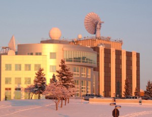 Photo by Ned Rozell. The Alaska Satellite Facility uses the 10-meter receiving antenna on top of UAF's Elvey Building, at right, on the west ridge of the UAF campus. The building at left houses the International Arctic Research Center.
