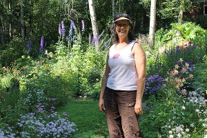 Cathi Bouton in her perennial garden. Photo by Nancy Tarnai