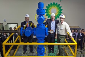UAF photo by Todd Paris. UAF Chancellor Brian Rogers, BP Exploration Alaska Inc., President John Mingé and UAF Community and Technical College process technology program coordinator Brian Ellingson turn the valve for the first time on the wellhead donated by BP Exploration Alaska Inc., to the process technology program P