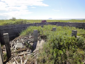 Photo by Aaron Cooke. A concrete foundation is all that remains of Shaktoolik's old school, abandoned after the village moved to a new site about 70 years ago.