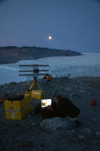 Photo courtesy Martin Truffer. Ryan Cassotto, left, of the University of New Hampshire and Martin Truffer of the University of Alaska use radar to monitor ³KNS² glacier in Greenland in summer 2011.
