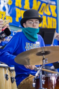 Alexander Bergman bangs the drums as a member of the UAF Pep Band during a recent hockey game in the Carlson Center.