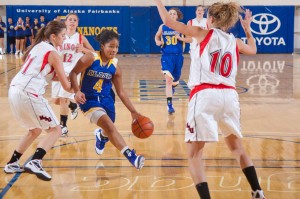 Freshman guard Nicole Hartzog drives through the lane on her way to another bucket during the Nanooks contest against Minot State.