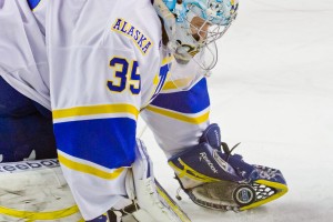 Goaltender Scott Greenham gloves the puck in front of the net during a Nanooks home game with Ferris State earlier in November.